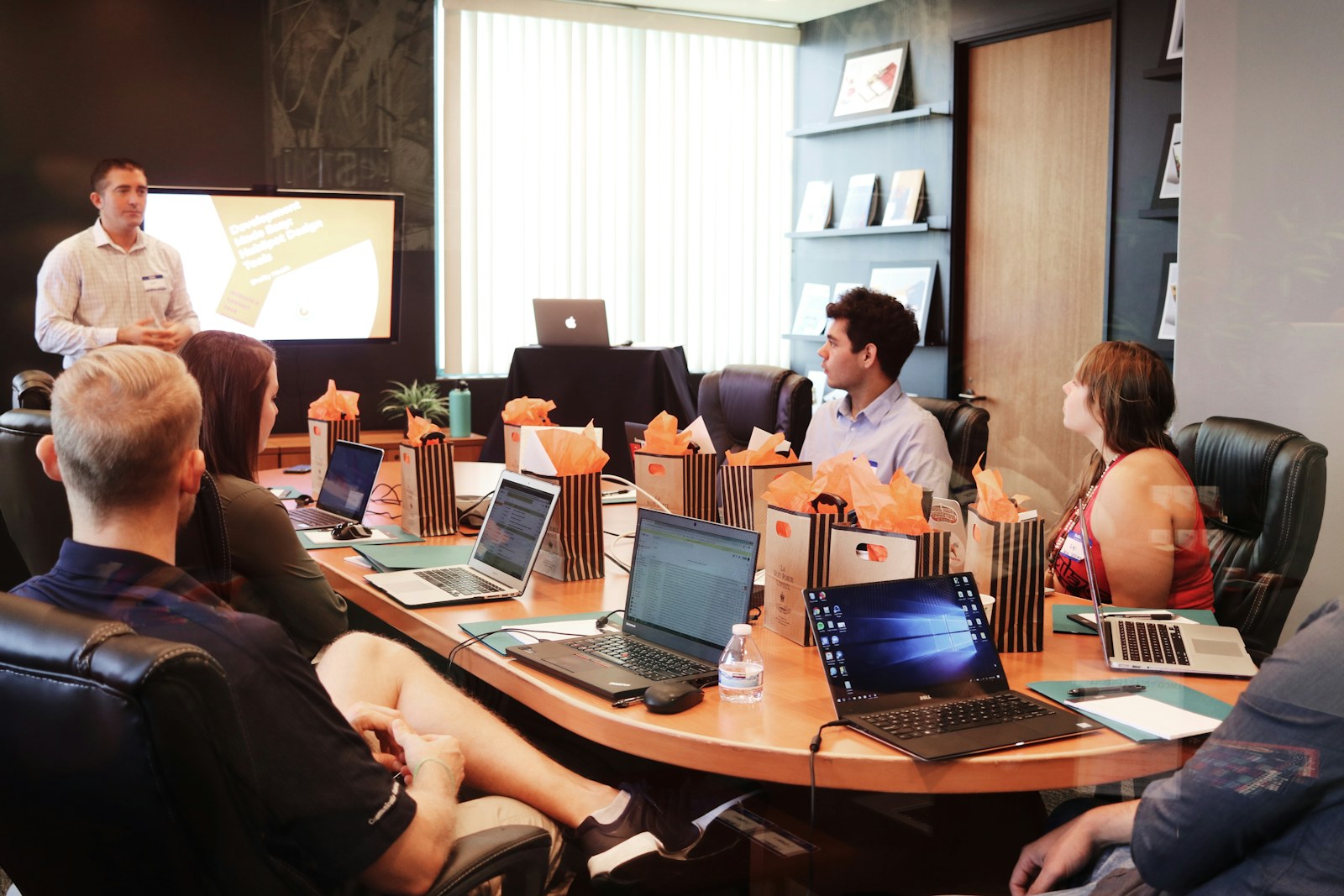 Sales team reviewing account plans in a meeting room